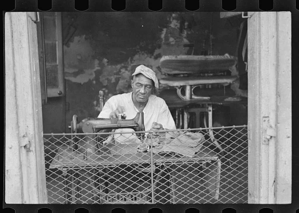 Scene in New Orleans, Louisiana. A street tailor, 1935