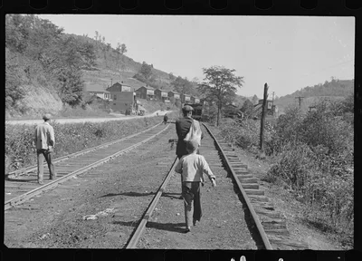 Scotts Run, West Virginia, walking into town for relief food, 1935