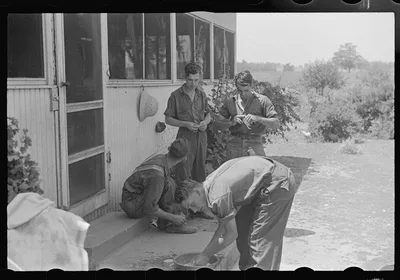 Waiting for dinner during wheat harvest, central Ohio, 1938