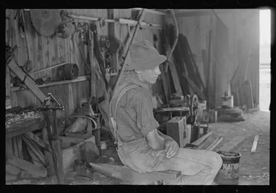 Wheat harvest hand in tool shed, central Ohio, 1938