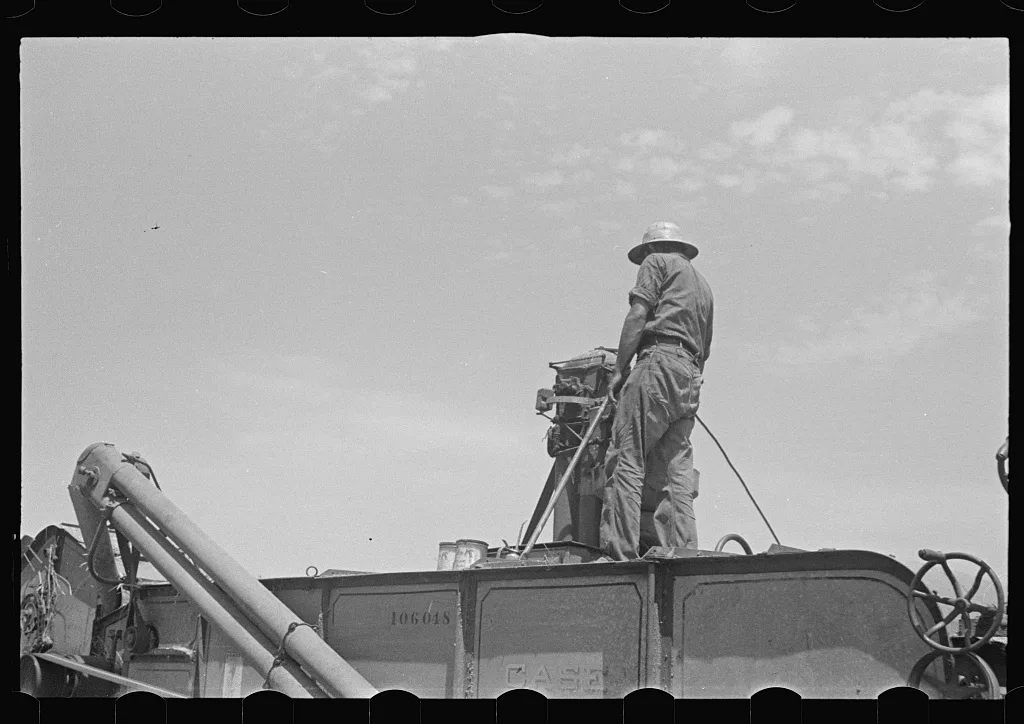 [Untitled photo, possibly related to: Loading hay from window with…, Ohio, 1938