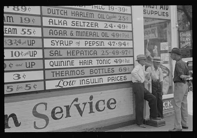 [Untitled photo, possibly related to: Sign on drugstore, Newark, Ohio], 1938