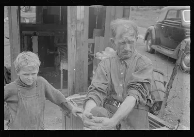 [Untitled photo, possibly related to: Ex-farmer and children, now on…, Ohio, 1938