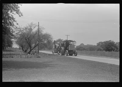 Steam thresher. These machines move from job to job under their own…, Ohio, 1938