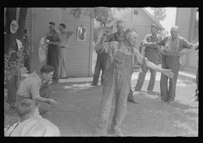 Political forum before dinner during wheat harvest, central Ohio, 1938