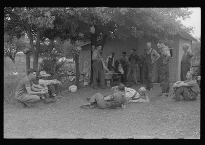 Political forum before dinner during wheat harvest, central Ohio, 1938