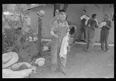 Washing up for dinner during wheat harvest, central Ohio, 1938