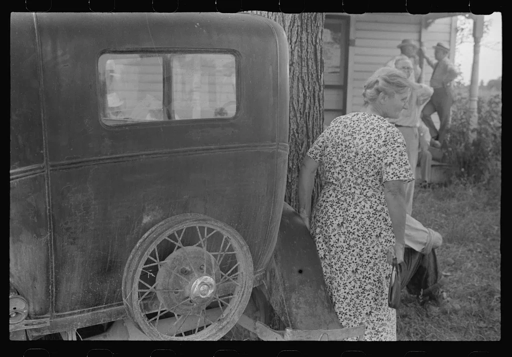 Farmer's wife watching proceedings at farm auction, New Carlisle…, Ohio, 1938