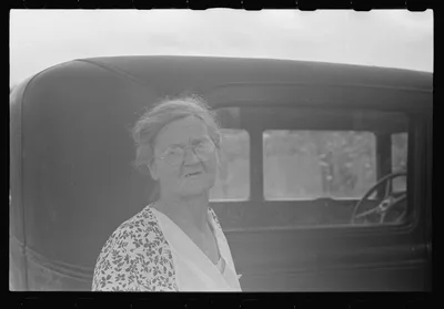 Farm woman at farm auction, New Carlisle [i.e. Marysville], Ohio, 1938