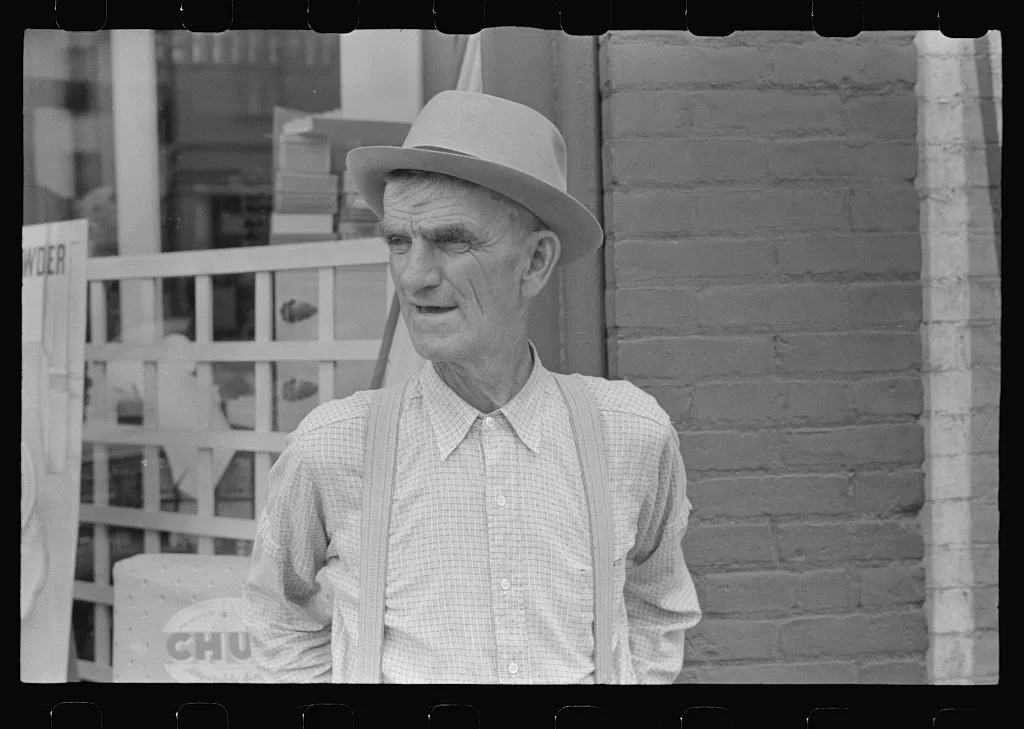 Man on street corner, Marysville, Ohio, 1938