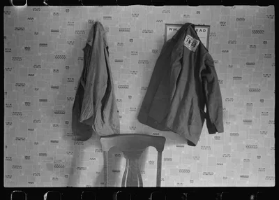 Clothes hanging in house at farmland auction, New Carlisle [i.e.…, Ohio, 1938