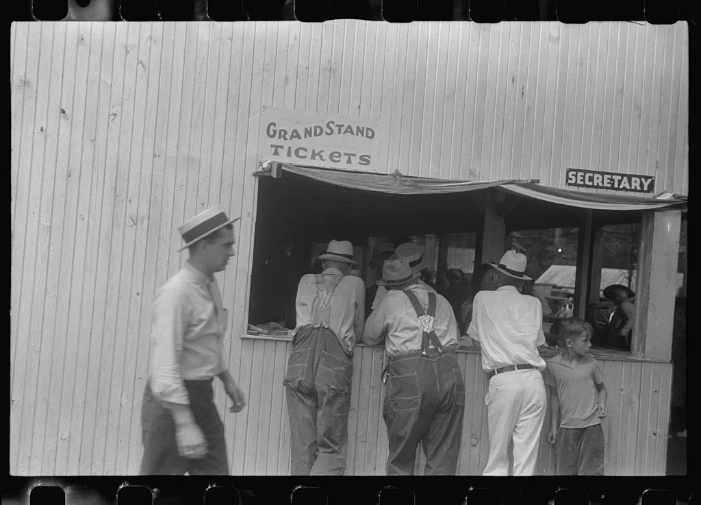 [Untitled photo, possibly related to: Purchasing tickets at county…, Ohio, 1938