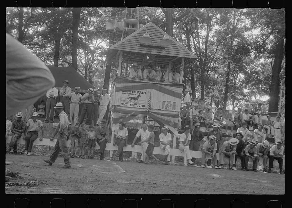 Spectators around judges stand, county fair in central Ohio, 1938