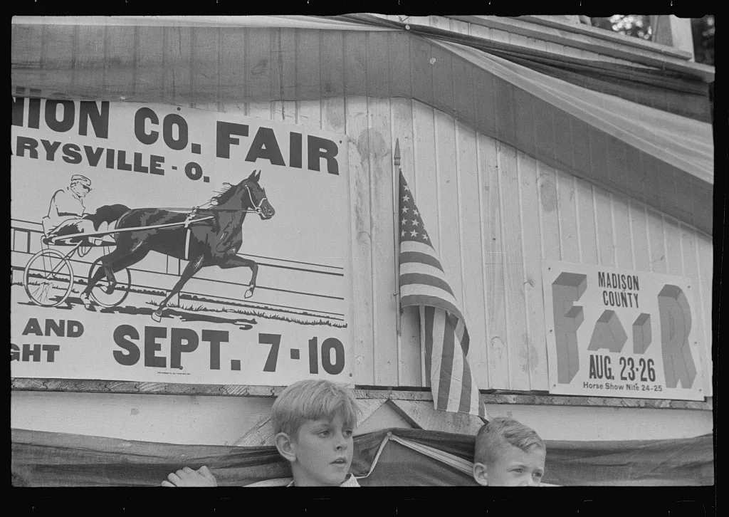 Advertisement on grandstand at county fair, central Ohio, 1938