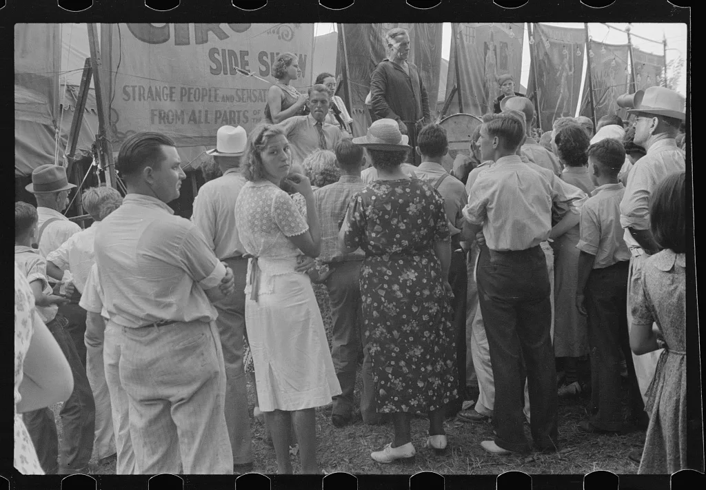[Untitled photo, possibly related to: Spectators at sideshow, county…, Ohio, 1938